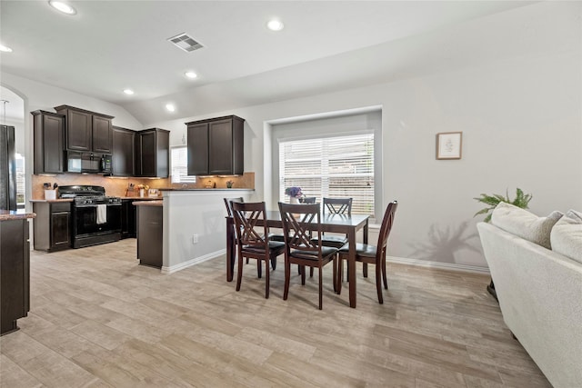 13215 Dover Bluff Dr, Rosharon, TX 77583 - dining space featuring recessed lighting, light wood finished floors, lofted ceiling, baseboards, and arched walkways