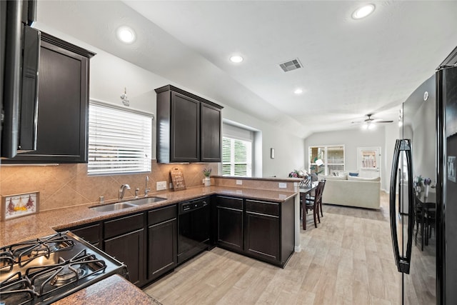 13215 Dover Bluff Dr, Rosharon, TX 77583 - kitchen with black appliances, a sink, light wood-type flooring, open floor plan, and ceiling fan