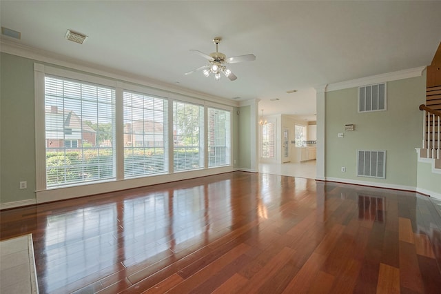 unfurnished living room featuring visible vents and ornamental molding