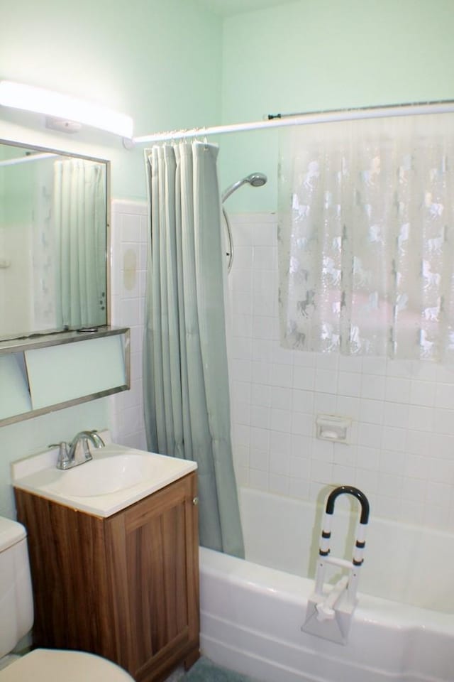 full bath with vanity, toilet, tile walls, and shower / bath combination with curtain