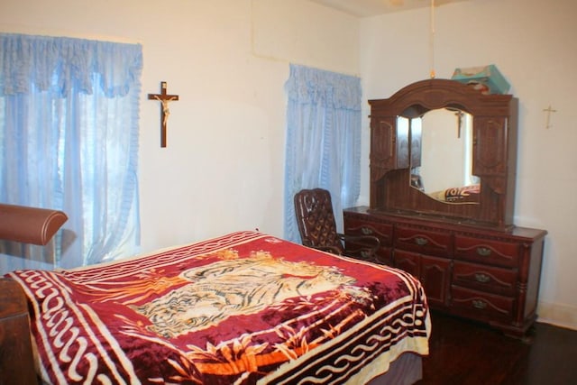 4334 Bell St, Houston, TX 77023 - bedroom featuring dark wood-style flooring