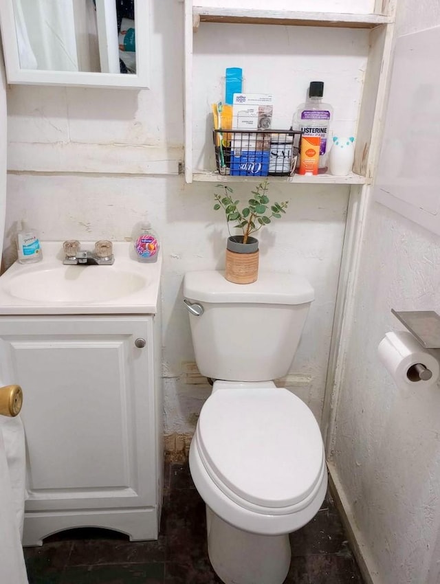 bathroom with vanity and toilet