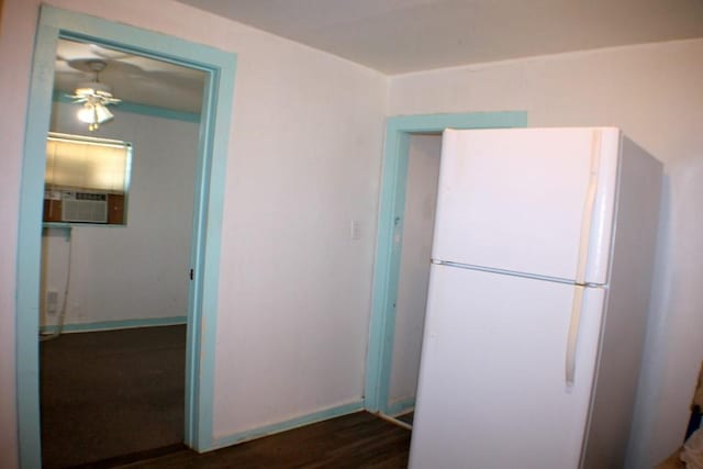 4334 Bell St, Houston, TX 77023 - kitchen with freestanding refrigerator, ceiling fan, cooling unit, and wood finished floors