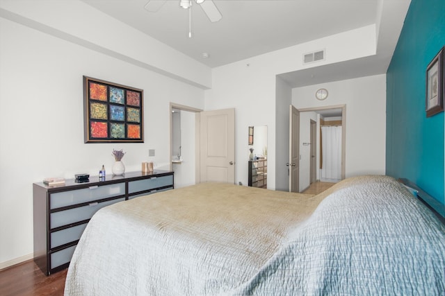 bedroom with visible vents, a ceiling fan, and dark wood-style flooring