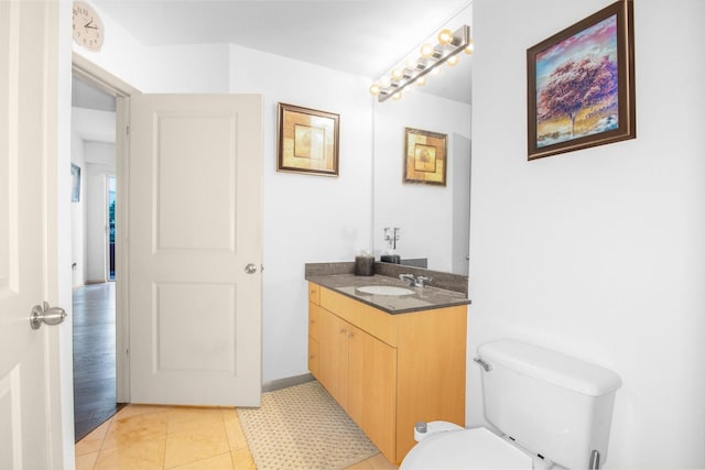 bathroom with toilet and vanity