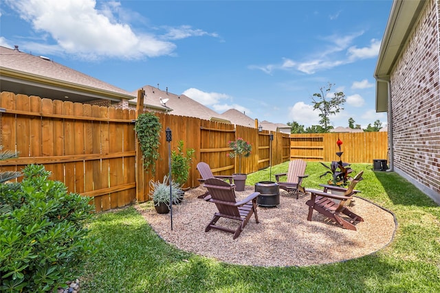 view of yard with an outdoor fire pit and a fenced backyard