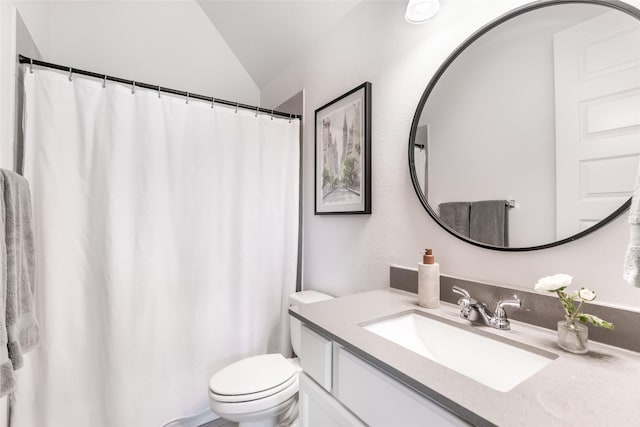 bathroom featuring toilet, vaulted ceiling, vanity, and a shower with shower curtain