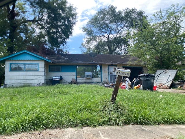 ranch-style house with cooling unit