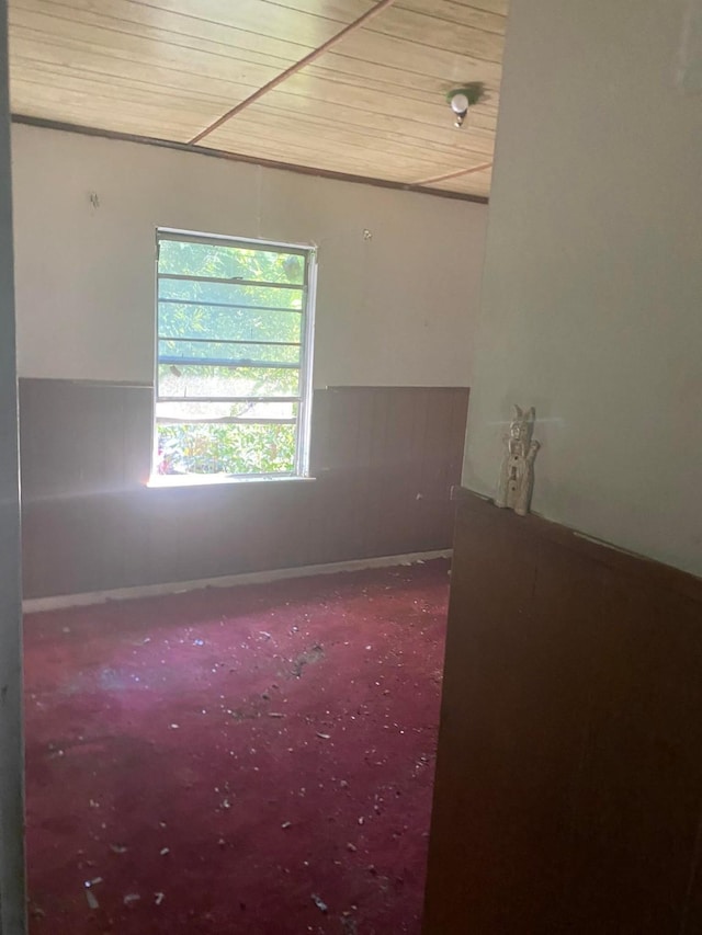spare room featuring wooden ceiling
