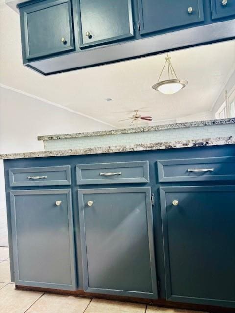 bar featuring light tile patterned floors, crown molding, and ceiling fan