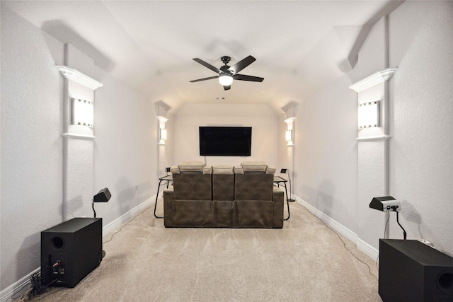 carpeted living area featuring ceiling fan, vaulted ceiling, and baseboards