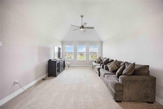 living room featuring lofted ceiling, ceiling fan, light colored carpet, and baseboards