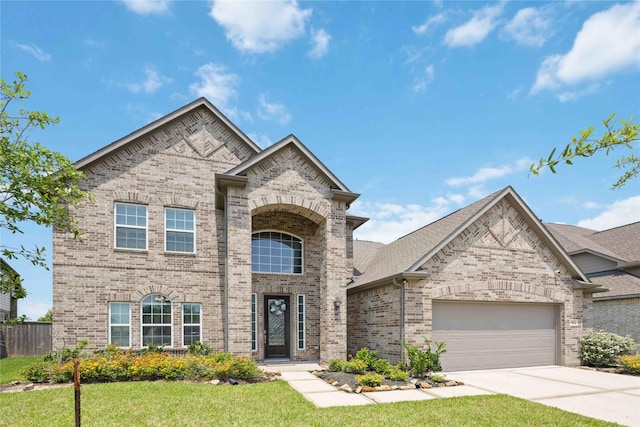 view of front of house with concrete driveway, an attached garage, fence, brick siding, and a front lawn