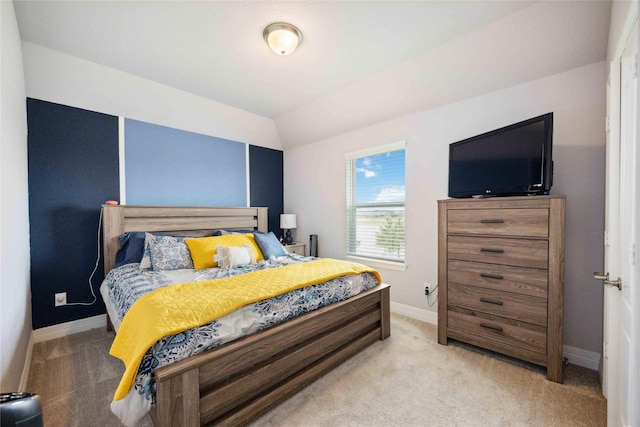 bedroom featuring baseboards and light carpet