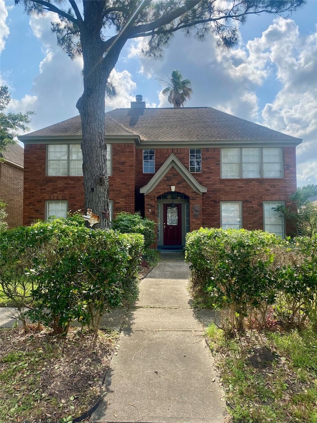 2106 Cherry Hills Dr, League City, TX 77573 - view of front facade featuring a chimney and brick siding