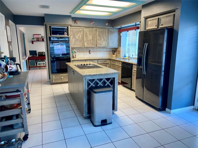 2106 Cherry Hills Dr, League City, TX 77573 - kitchen with decorative backsplash, a sink, visible vents, a kitchen island, and black appliances