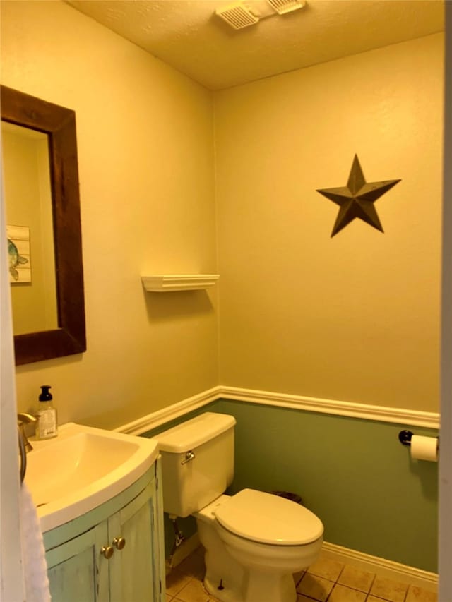 2106 Cherry Hills Dr, League City, TX 77573 - half bath with vanity, toilet, visible vents, baseboards, and tile patterned flooring