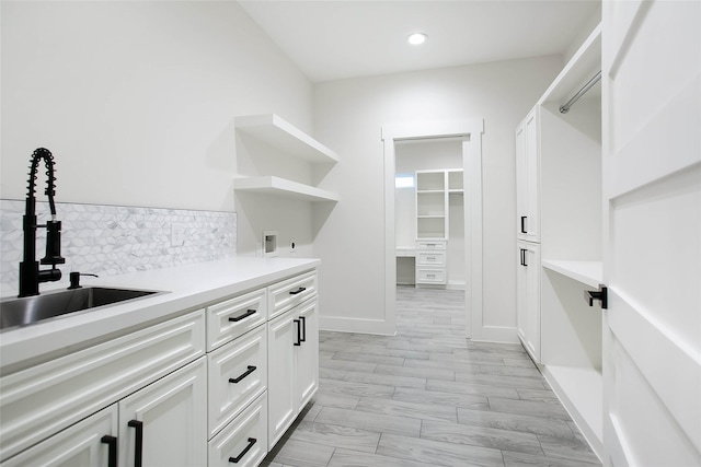 17522 Julianne Dr, Waller, TX 77484 - laundry room featuring recessed lighting, washer hookup, cabinet space, and a sink