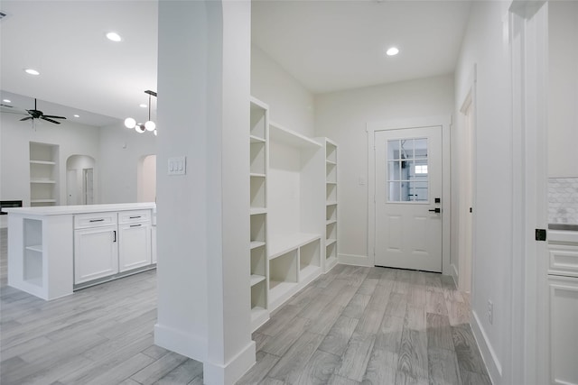 17522 Julianne Dr, Waller, TX 77484 - mudroom with light wood-style floors, ceiling fan, baseboards, and arched walkways