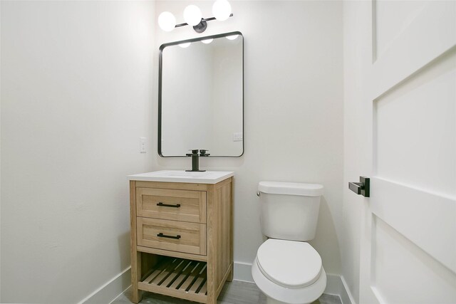 17522 Julianne Dr, Waller, TX 77484 - bathroom featuring toilet, vanity, and baseboards