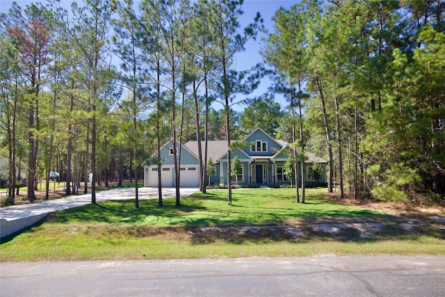 17522 Julianne Dr, Waller, TX 77484 - view of front of house with concrete driveway, an attached garage, and a front lawn