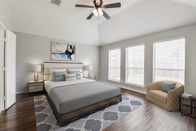 7403 Hickory Canyon Ct, Humble, TX 77396 - bedroom featuring lofted ceiling, visible vents, ceiling fan, baseboards, and wood finished floors