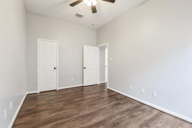 7403 Hickory Canyon Ct, Humble, TX 77396 - unfurnished room featuring visible vents, ceiling fan, dark wood-style floors, and baseboards
