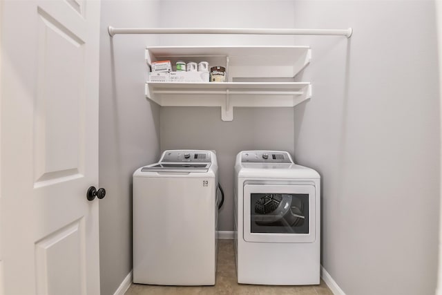 7403 Hickory Canyon Ct, Humble, TX 77396 - laundry room featuring baseboards, laundry area, and independent washer and dryer