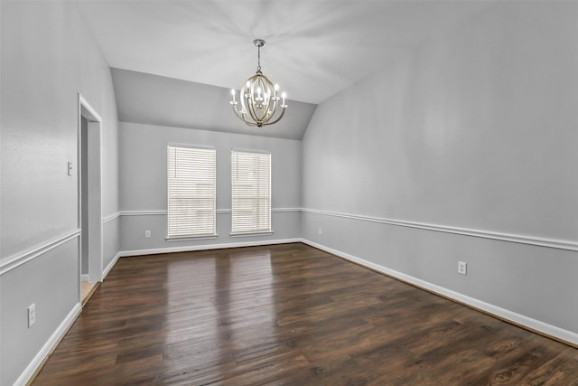 7403 Hickory Canyon Ct, Humble, TX 77396 - empty room with an inviting chandelier, wood finished floors, vaulted ceiling, and baseboards