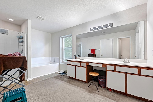 full bath featuring a textured ceiling, a shower stall, a sink, visible vents, and a bath