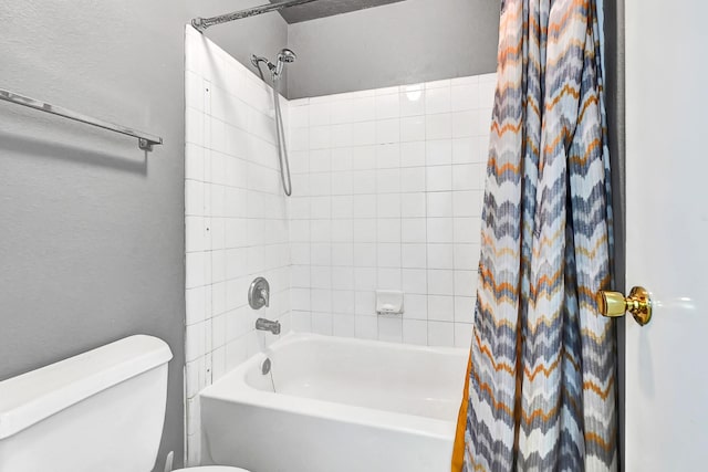 bathroom featuring shower / bathtub combination with curtain and toilet