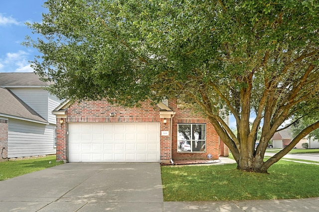view of front facade with concrete driveway, a front yard, an attached garage, and brick siding