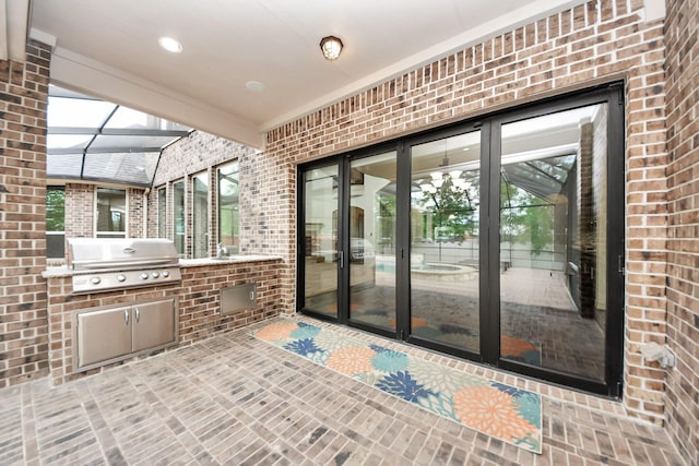 exterior space with a sink, an outdoor kitchen, and area for grilling