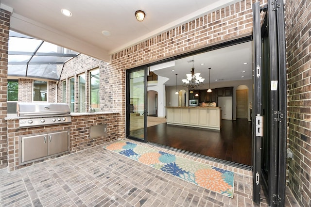 exterior space with exterior kitchen and grilling area