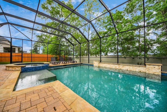 view of pool featuring a patio area and a pool with connected hot tub