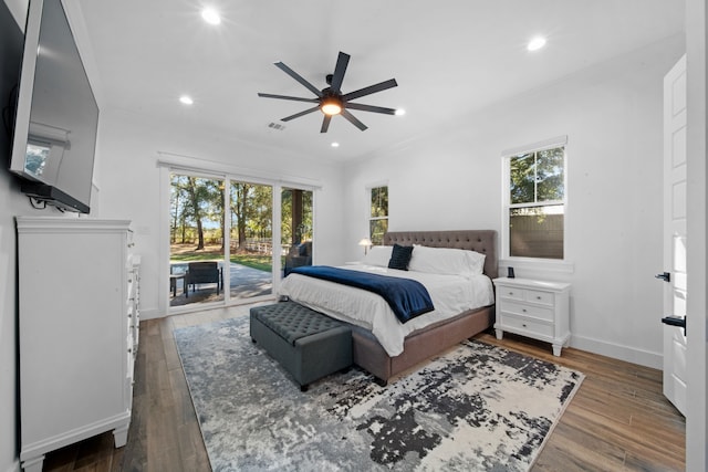 bedroom featuring recessed lighting, access to exterior, visible vents, baseboards, and wood finished floors
