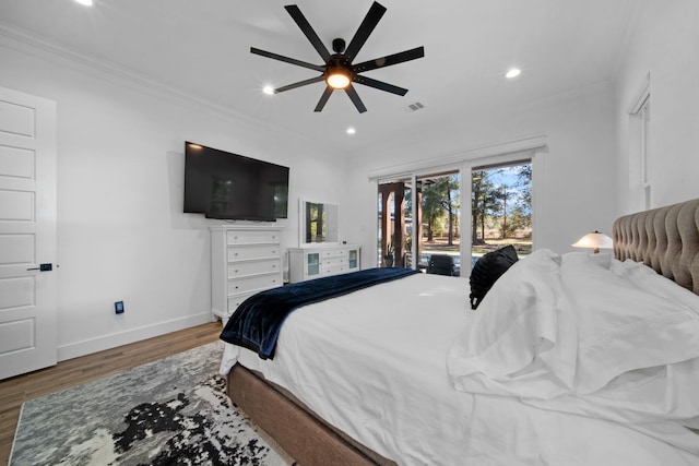 bedroom with recessed lighting, visible vents, baseboards, ornamental molding, and wood finished floors
