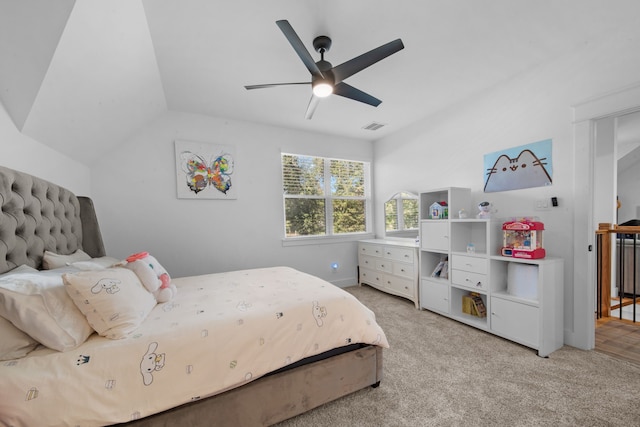 bedroom with visible vents, light carpet, ceiling fan, and vaulted ceiling