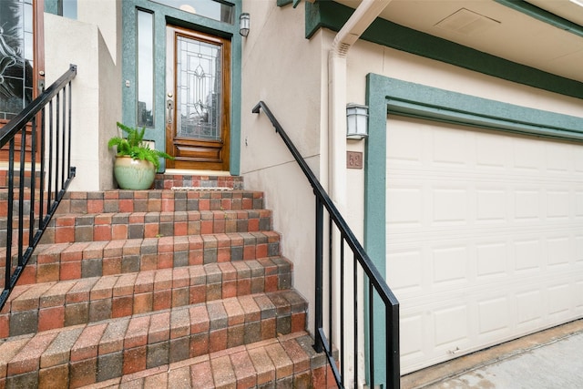 452 Mariners Dr, Kemah, TX 77565 - entrance to property with a garage and stucco siding
