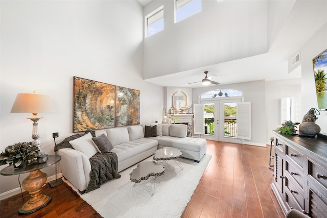 452 Mariners Dr, Kemah, TX 77565 - living area with light wood finished floors, a high ceiling, visible vents, and a healthy amount of sunlight