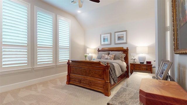 carpeted bedroom featuring visible vents, a ceiling fan, baseboards, and vaulted ceiling