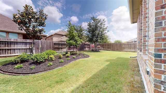 view of yard with a fenced backyard
