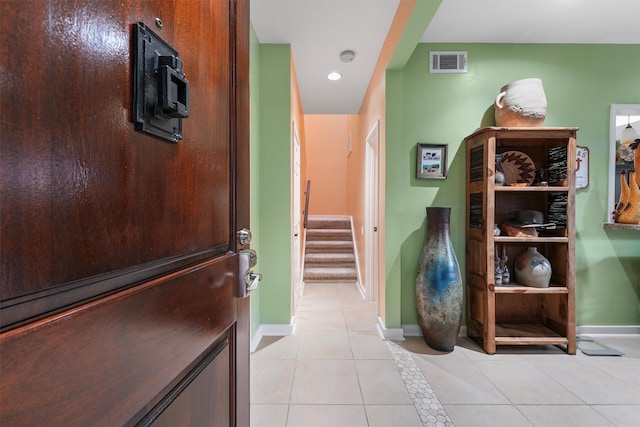 hall featuring visible vents, stairs, light tile patterned flooring, baseboards, and recessed lighting