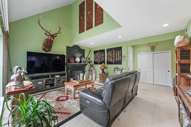 tiled living area with a fireplace and recessed lighting