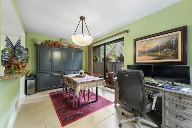 home office with baseboards and light tile patterned floors