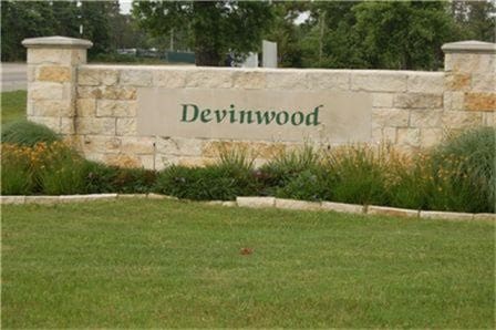 community / neighborhood sign featuring a lawn