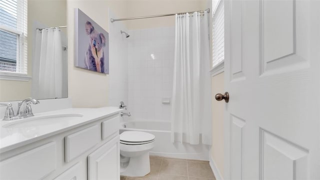 full bathroom with tile patterned floors, shower / bath combination with curtain, toilet, and vanity