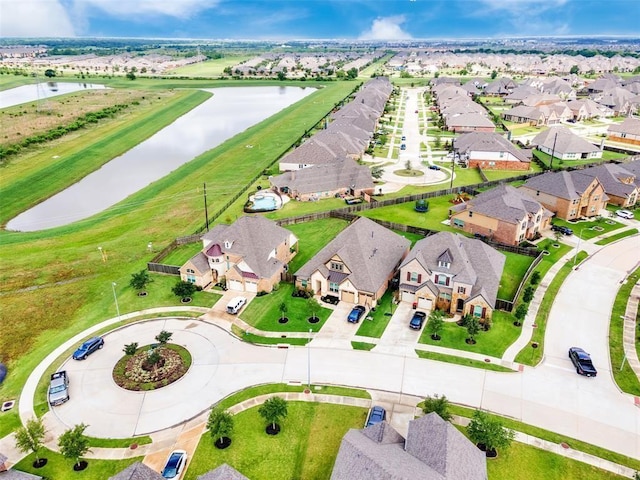 birds eye view of property featuring a residential view and a water view