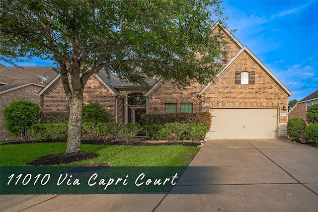 11010 Via Capri Ct, Richmond, TX 77406 - view of front of property with brick siding, concrete driveway, and a front yard