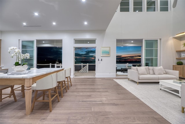 dining area featuring wood finished floors and recessed lighting